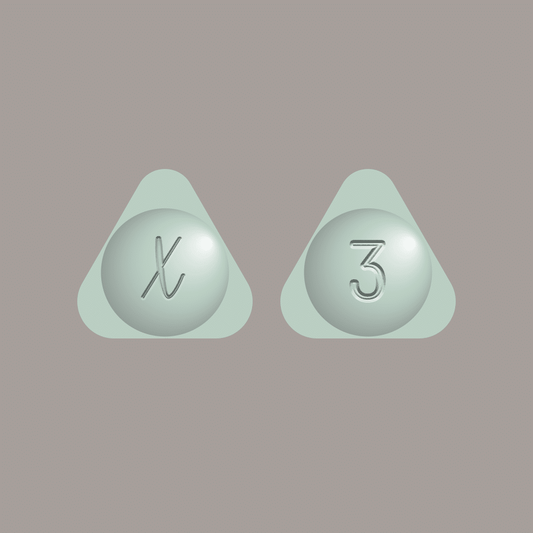 Xanax XR 3mg pills displayed on a soft background, representing prescription medication for anxiety.